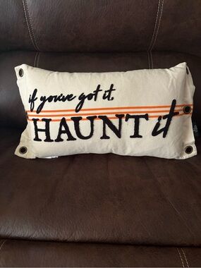 Halloween “If you got it haunt it” tan pillow with tarnished bronze detailing.